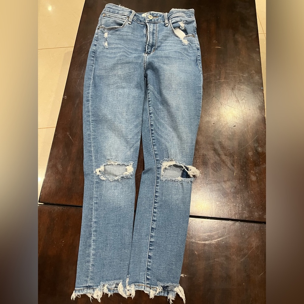 Light blue ripped jeans